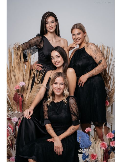 Fekete mini ruha, puffos ujjakkal és különleges hátkivágással.