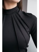 Egy igazán nőies, szűk szabású fekete színű midi ruha.