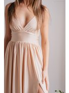 V kivágású, elasztikus anyagból készült, pezsgő színű maxi ruha. 